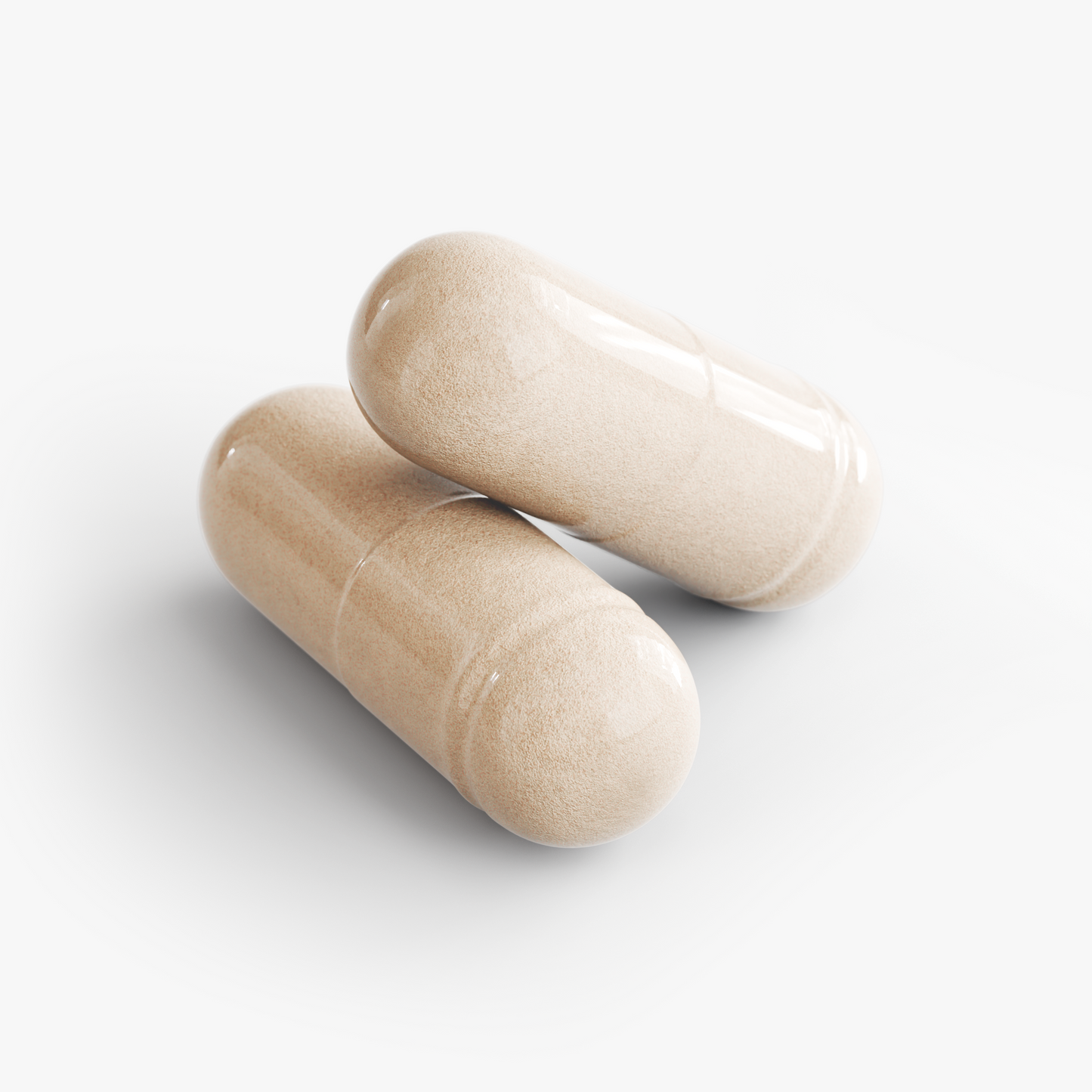 Two beige translucent capsules lying on a light gray background.