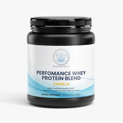 A black tub of Balanced Bayou Performance Whey Protein Blend in Vanilla flavor, shown on a clean white background with a small pile of light beige powder in front.