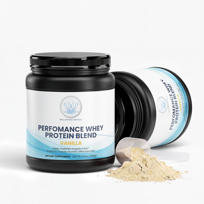 A black tub of Balanced Bayou Performance Whey Protein Blend in Vanilla flavor, shown on a clean white background with a small pile of light beige powder in front.