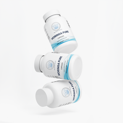 Three white bottles of Moringa Pure Capsules floating in a stacked arrangement against a clean white background.