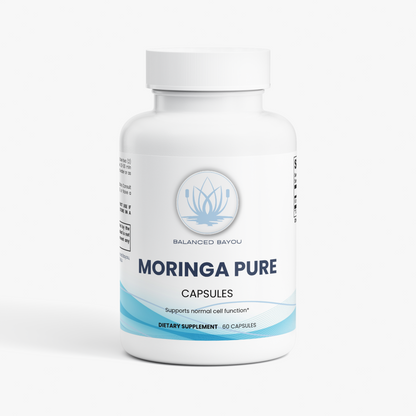 A white plastic bottle of Balanced Bayou Moringa Pure dietary supplement capsules, featuring a clean white label with light blue accents and a white cap, set against a plain white background.