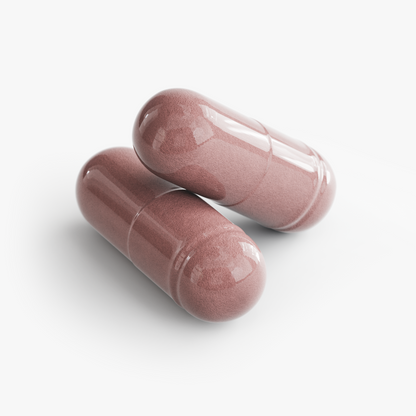 Two pink capsules on a white background