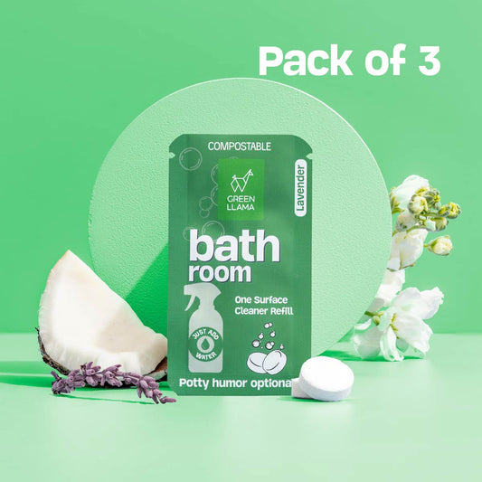 Pack of 3 compostable bath room one surface cleaner refills on a green background with flowers and a coconut.