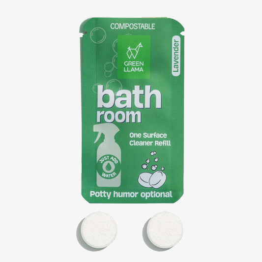Green packaging of a bath room one surface cleaner refill with two white tablets on a white background