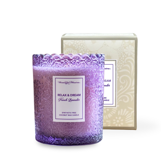 Purple candle with decorative packaging on a white background