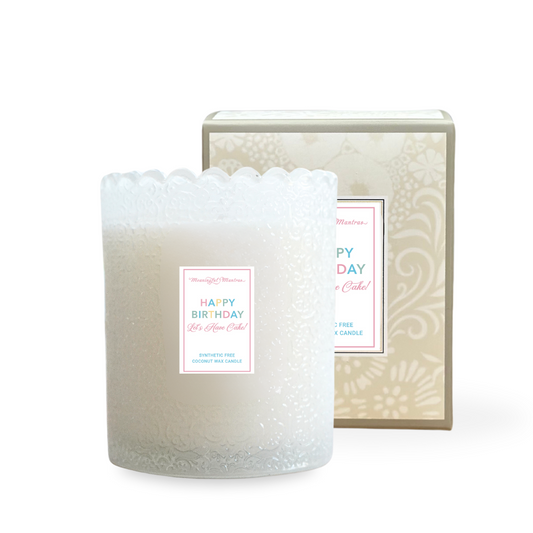 White candle with decorative packaging on a white background