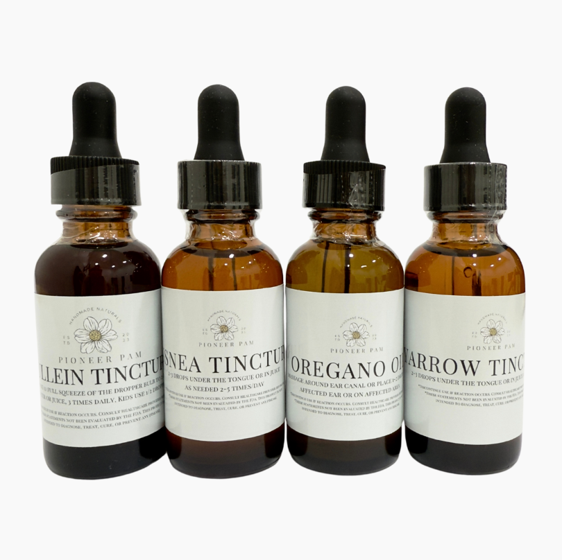 Four bottles of tinctures with droppers