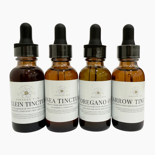Four bottles of tinctures with droppers