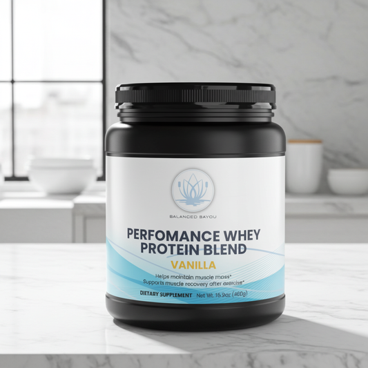 A black plastic tub of Balanced Bayou Performance Whey Protein Blend in Vanilla flavor, featuring a white and light blue label, set against a clean white background.